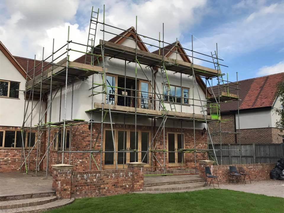 Domestic scaffolding for a 2 level house with timber frame windows & doors